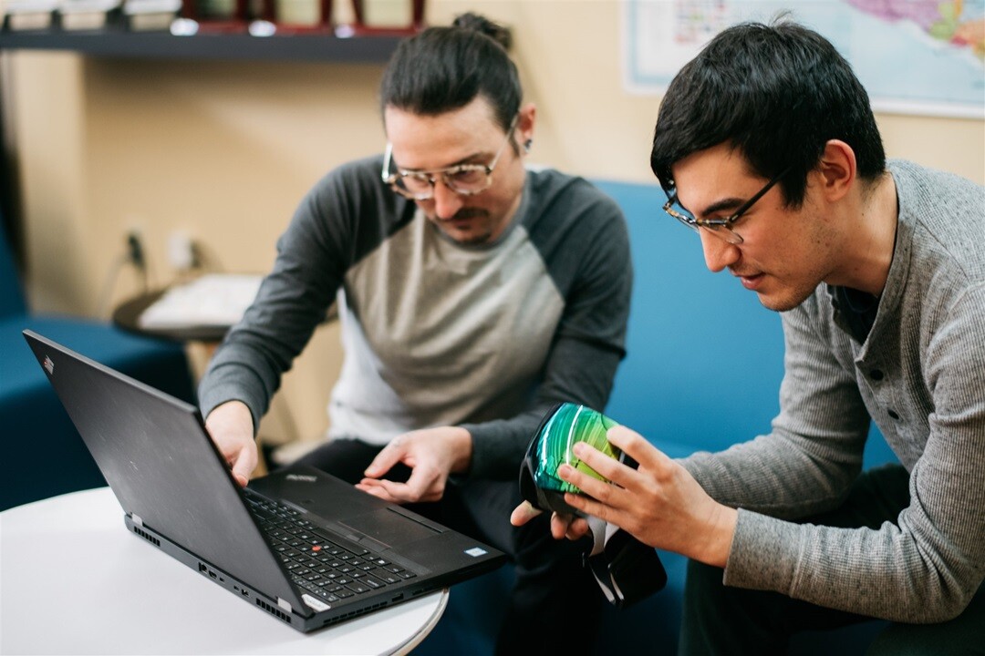 Engineers work on optics